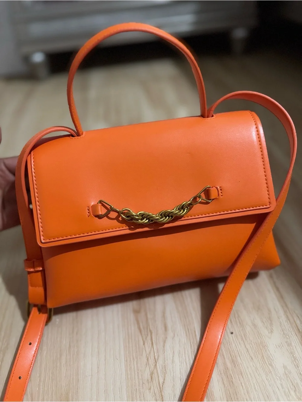 Orange Leather Top-Handle Crossbody Bag with Gold Chain Accent